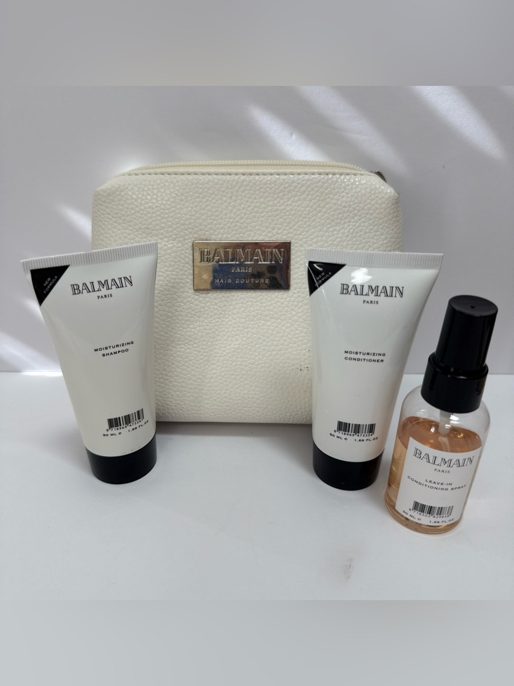 Balmain Paris faux Leather Travel Bag shampoo/conditioner/leave in cond spray
